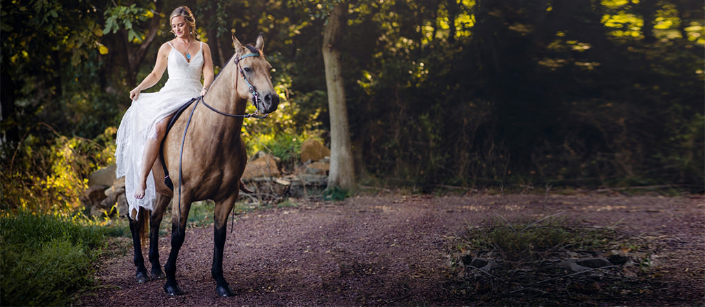A bride riding to the wedding ceremony on a horse. The bride was riding bareback and barefoot. This is for the article called non-traditional wedding ceremony ideas